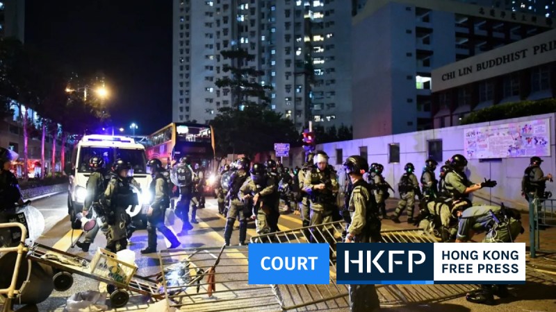 Hong Kong police clear barricades set up by protesters in the Tseung Kwan O area of Kowloon in Hong Kong on October 13, 2019. Photo: AFP/Anthony Wallace.